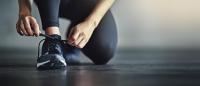 woman tying their shoe